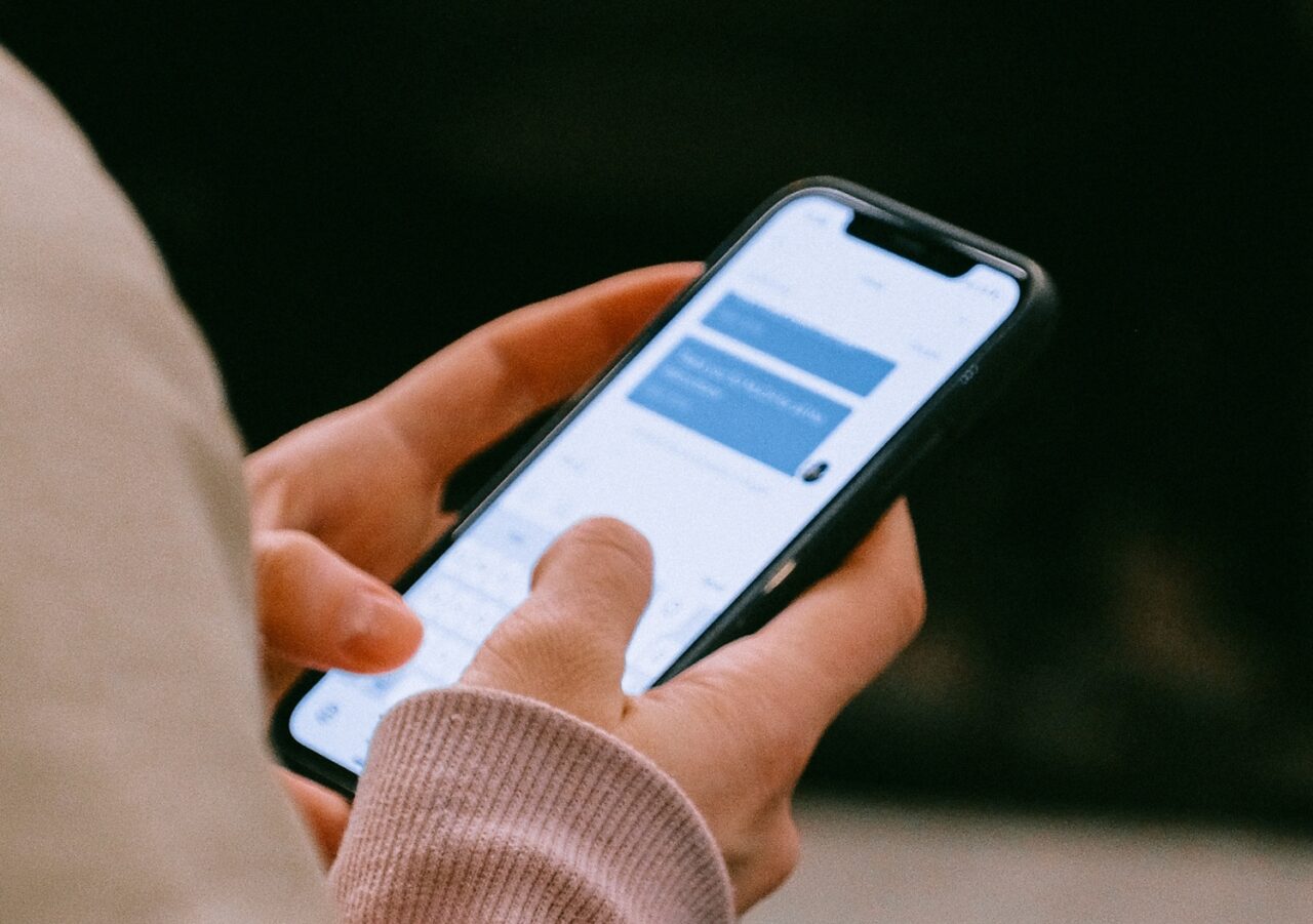 A person types on the phone the massage for 2021.