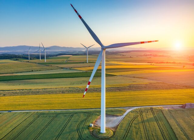 Wind turbines on the field show the potential of wind power in the UK.