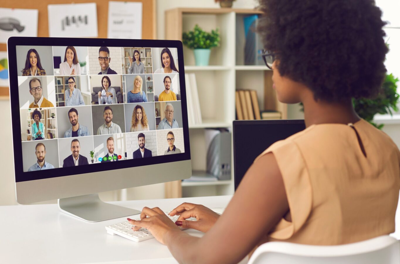 an image showing a young woman having a zoom call on hybrid work model