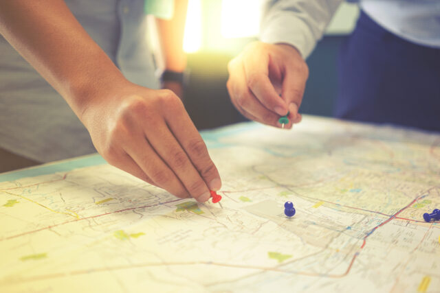 Two people look at the map that represent customer value journey.