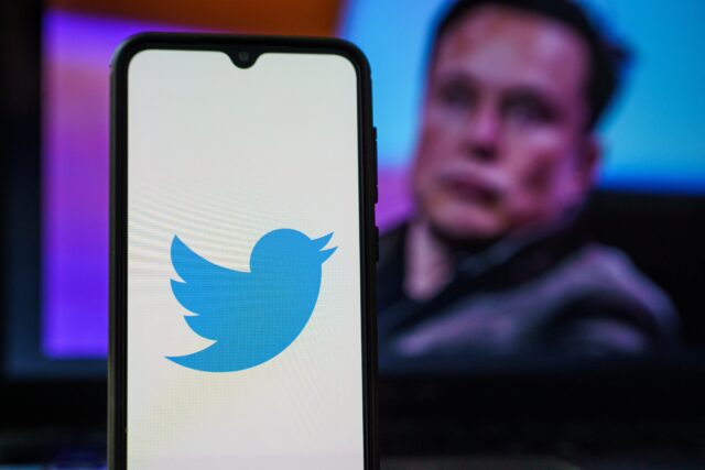 Twitter logo and Elon Musk