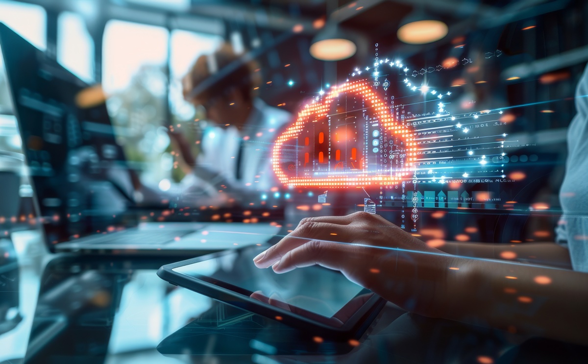 Cloud-based contact centre and person using a laptop.