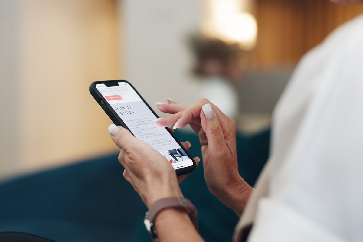 Hands, woman and phone screen for online shopping, reading post or target advert. Female, closeup or smartphone for product website, marketing ad or social media for chatting, connectivity or texting.
