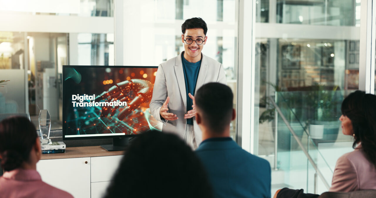 Person in front of a screen explaining digital transformation