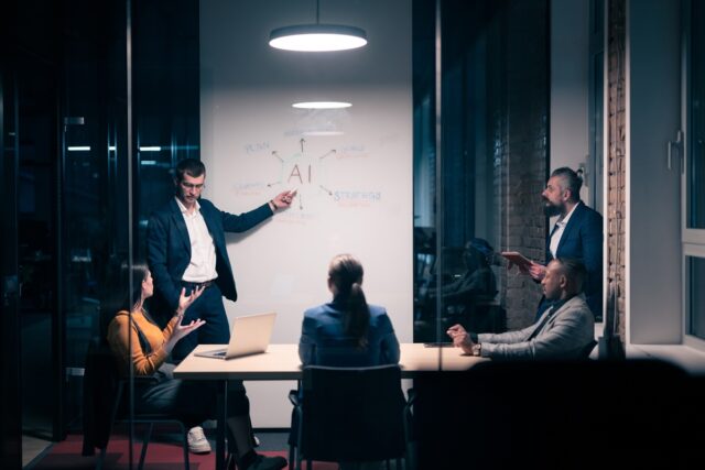 Businessmen talking about an AI strategy.