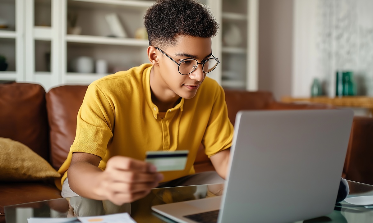 A young man making an online payment.